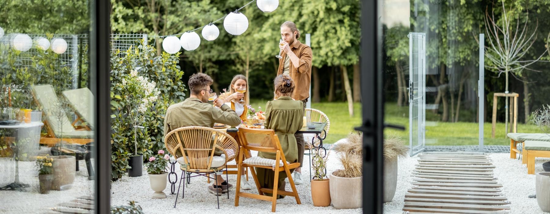 a group of people sitting at a table outside