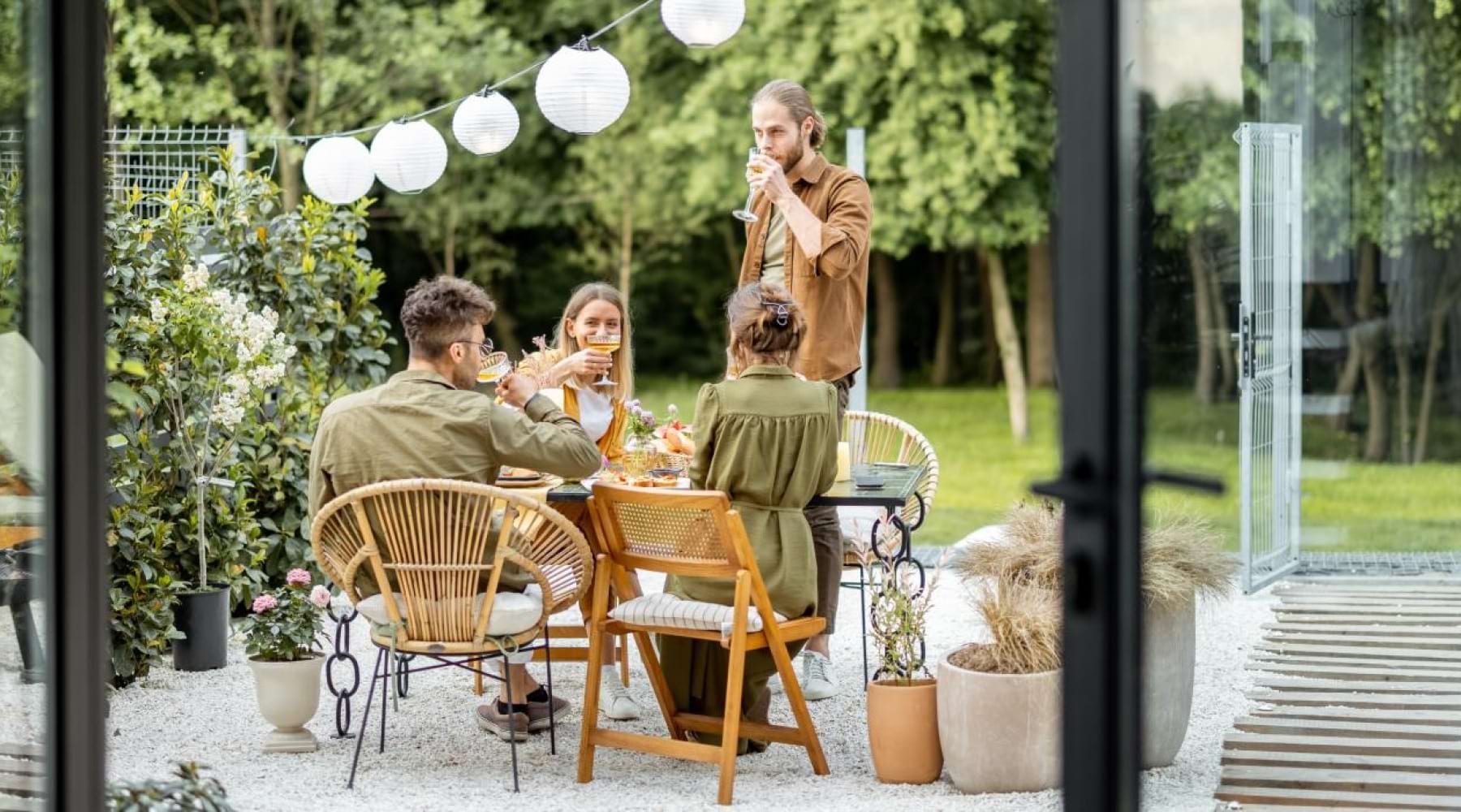 a group of people sitting at a table outside
