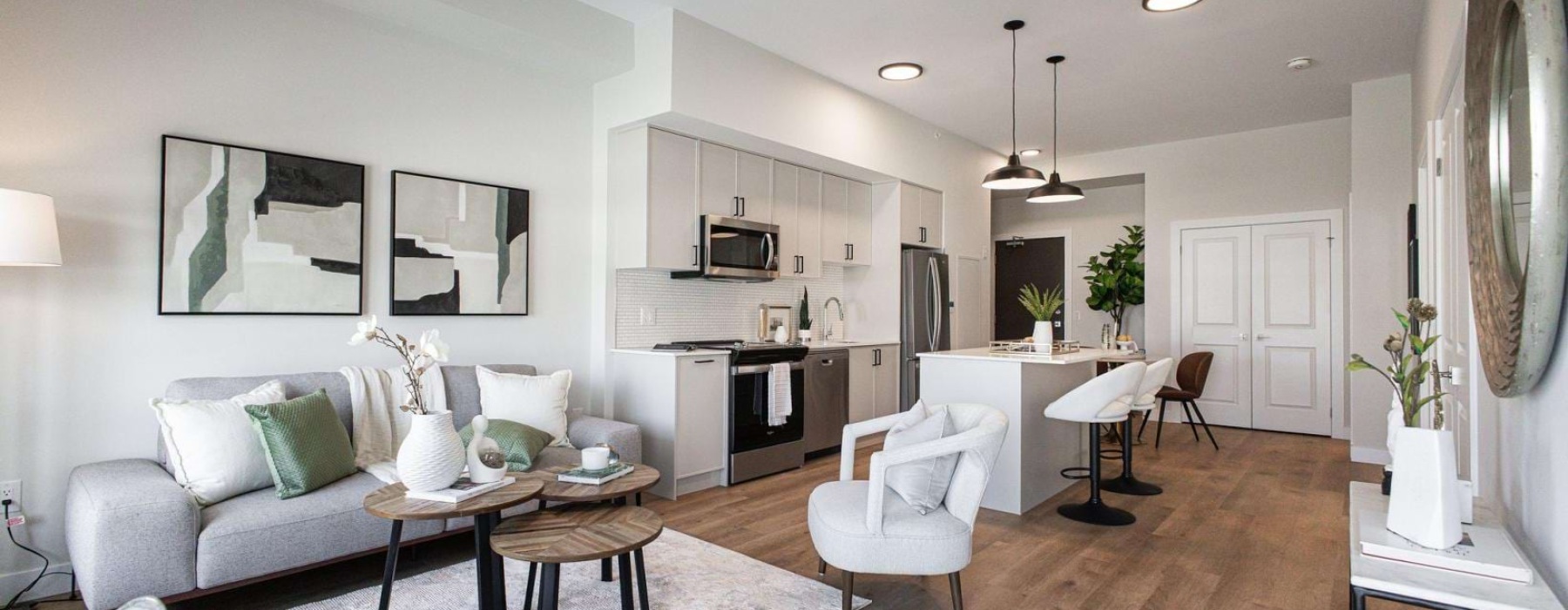 a living room with a dining table and couches