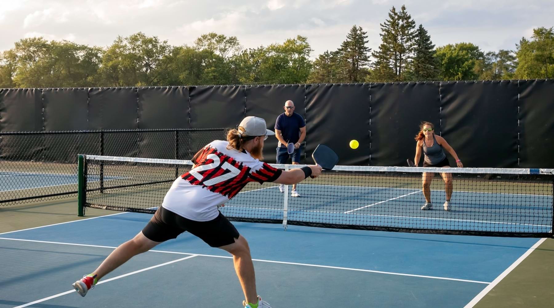 a woman hitting a ball with a tennis racket